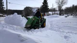 John deere 1026r cold start and loader snow removal [upl. by Ertnom979]