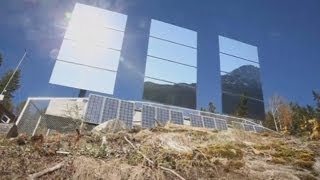 Giant mirrors reflect sunshine into dark Norway town of Rjukan [upl. by Soulier]