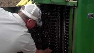 Brownsferry Cotton Farm cleaning spindles on cotton picker [upl. by Htinnek671]