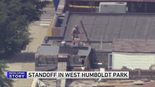 SWAT responds to man on rooftop of Humboldt Park building [upl. by Zoarah]