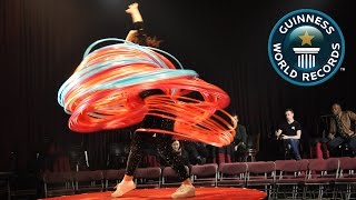 SPOTLIGHT  Most hula hoops spun simultaneously [upl. by Yelknirb842]