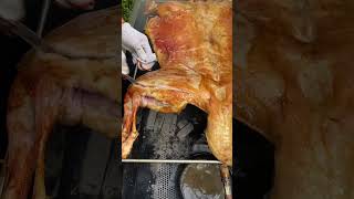 Roasted whole lamb is golden in color carne asado comida delicioso [upl. by Hartmunn]