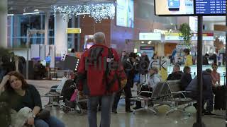 People in waiting area of Terminal D in Sheremetyevo Airport Moscow [upl. by Leuqcar]