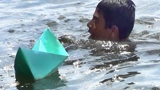 Paper boat making and floating in River Basic Wings and Knife paper boats [upl. by Oiuqise]