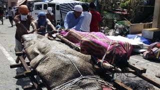 Typhoon Haiyan aftermath 10000 feared dead in Philippines [upl. by Yllatan233]