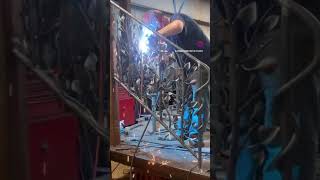 Working on a handrail all forged blacksmith forgemaster decorativeironwork welding blacksmith [upl. by Eseuqram934]