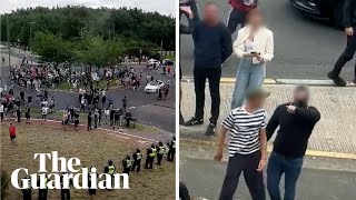 Asylum seekers film rioters making threatening gestures as they surround Rotherham hotel [upl. by Bremer]