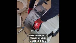 REMOVING PEGS FROM LAUNDRY MACHINE DRUM subscribe laundry homeappliance repair [upl. by Wilde]