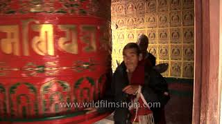 Pilgrims spinning the giant prayer wheel  Boudhanath Temple Nepal [upl. by Dreeda570]