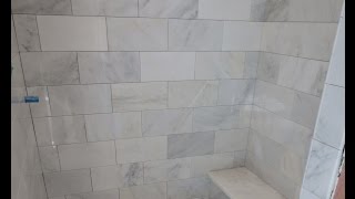 Complete Carrara Marble tile bathroom instalation time lapse [upl. by Aratnahs]