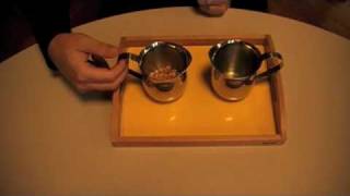 Montesori  Practical Life  Preliminary Exercices  Pouring Grains [upl. by Enylrac534]