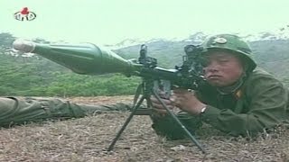 State TV shows North Korean soldiers shooting at a paper [upl. by Antonina738]