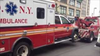 RARE LARGE FDNY TOW TRUCK WRECKER TOWING A NEW FDNY AMBULANCE ON W 125TH ST IN HARLEM NEW YORK [upl. by Elvah]