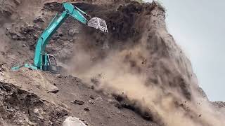 Sand miningCutting cliffs with a Kobelco SK 200 excavator in a sand mine [upl. by Etram188]