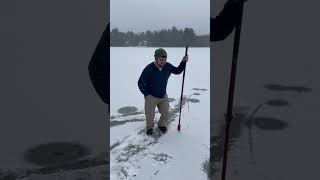 Two Holes in Ice Spitting Water as a Guy Checks Ice Thickness [upl. by Kiele]