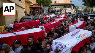 Mourners attend the funeral of 10 Lebanese killed in Israeli airstrike [upl. by Adore]