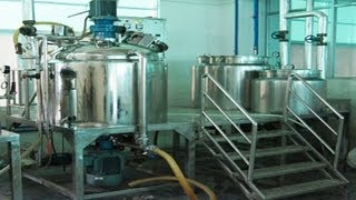 workers operating vacuum cream emulsifying machine in cosmetics factory homogenizing mixer equipment [upl. by Urbas]