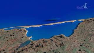 Longshore drift creating a spit and turning bay into lagoon [upl. by Marron]