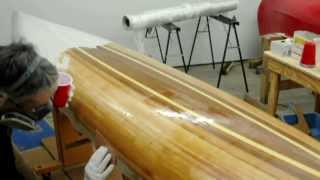 Fiberglassing a wooden kayak hull [upl. by Yhtur]