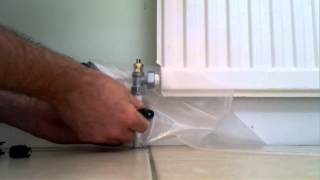 Draining a radiator  Replacing a valve  Its super easy with Rapid RaDrain [upl. by Yleve]