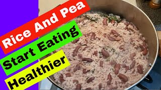 Jamaican Rice And Peas Recipe With Coconut Milk  Bob Marley Favorite Food [upl. by Jobe]