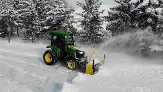 71 John Deere 3046R Cab Tractor Snow Blowing My Neighbors Driveway From the Mavic Air [upl. by Nwahsyd]