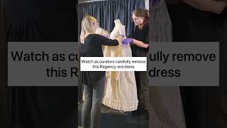 Watch an 1810s white cotton dress coming off display in the fashion museum galleries JaneAustenDay [upl. by Gothar237]