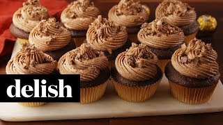 How to Make Ferrero Rocher Stuffed Cupcakes  Recipe  Delish [upl. by Schreib]