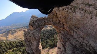 Wingsuit Pilot Flies Through Hole In Rock [upl. by Ecirtram947]