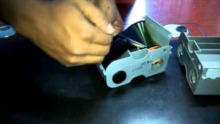 How to change ribbon on Fargo DTC1250e ID DirectToCard Printer amp Encoder [upl. by Cresida840]