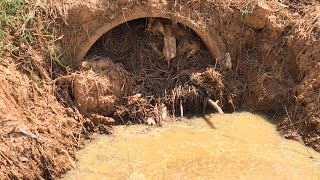 Clog Clogged Culvert Drain Releasing And Cleaning Debris Stuck In Drains [upl. by Il]