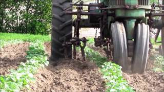 Cultivating potatoes with a two row cultivator on a John Deere 70 [upl. by Nathanial699]