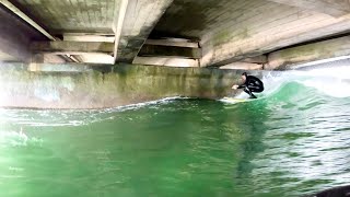 Surfing RARE under bridge Novelty wave [upl. by Yarased]