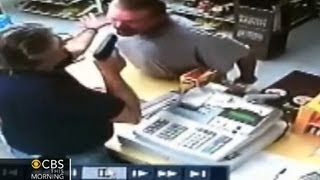 Watch Liquor store cashier pulls gun on wouldbe robber [upl. by Korb]