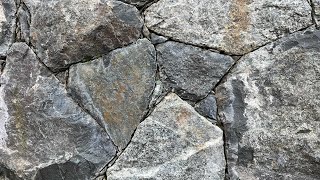 Secrets to creating a beautiful NATURAL STONE WALL Insights from a real stonemason [upl. by Adhamh]