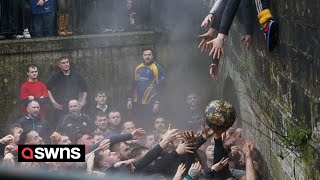 Royal Shrovetide Football in Ashbourne Derbyshire  SWNS [upl. by Norej854]