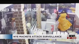 Surveillance video shows panicked crowd running from man wielding machete on New Years [upl. by Llenrrad270]