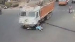 Dramatic crash Trucks runs over woman on scooter [upl. by Notlef584]