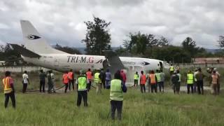 Asia Airline Boeing 737300F skidded off runway at Wamena Airport Indonesia [upl. by Eenehs]