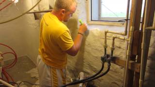 Applying BASF Thoroseal concrete based coating to waterproof basement walls [upl. by Ennirak]