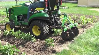 8 John Deere 1025R Hilling Potatoes amp Corn with Disc Hillers  Listers [upl. by Noskcire692]