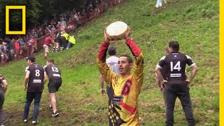 Watch a Downhill CheeseChasing Competition in Britain  National Geographic [upl. by Melessa329]