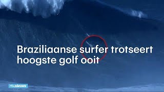 Bizarre beelden Braziliaanse surfer trotseert hoogste golf ooit  RTL NIEUWS [upl. by Nihhi]