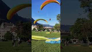 Tandem Paragliding Frenzy Smooth Landing Amidst Chaos at Interlaken Höhenmatte [upl. by Annaerda768]