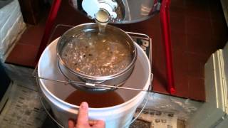 Filtering Honey After Extraction using Coarse and Fine mesh filters [upl. by Balthasar]