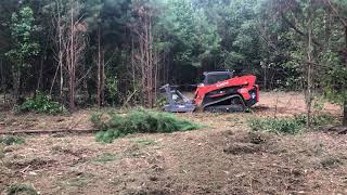 Kubota SVL95 with Loftness disc mulcher clearing pine thicket [upl. by Waters4]