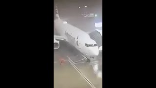 Winds Whip Plane Away From Gate At Dallas Fort Worth Airport [upl. by Levenson]