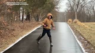 Boy ice skates down frozen street in galoshes [upl. by Town]