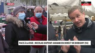 Nicolas DupontAignan dans face à la rue sur le marché de Bobigny au micro de Morandini 03022022 [upl. by Llacam]