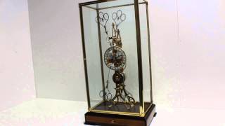 Beautiful rare gilt brass 8 day duration scissor escapement fusee skeleton clock in display case [upl. by Sualocin]